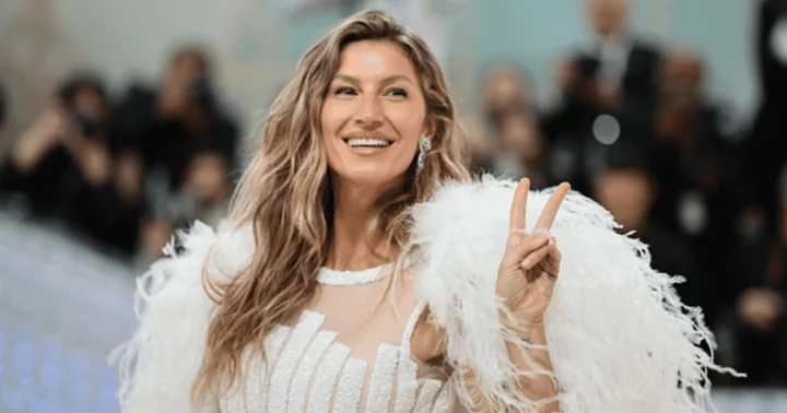 Gisele Bundchen looks chic and elegant in a green blouse and jeans during a shopping trip in Miami