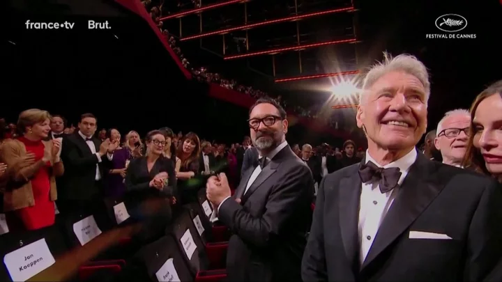 Awkward moment Harrison Ford and Calista Flockhart are moved away from each other at Cannes premiere