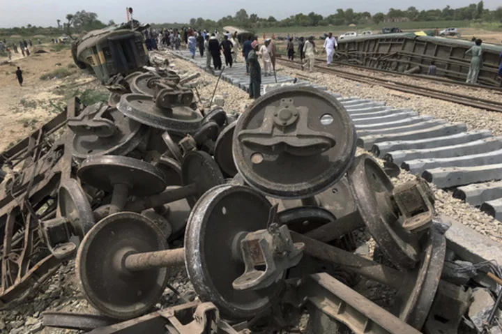 Engineers partially restore rail service after train derailed in southern Pakistan, killing 30