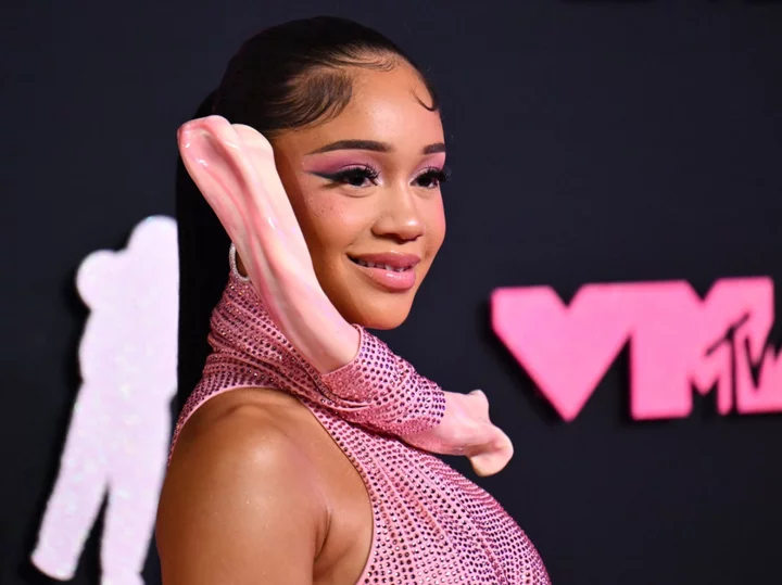 Saweetie’s ‘caveman’ inspired VMAs dress unsurprisingly sparks comparisons to The Flintstones